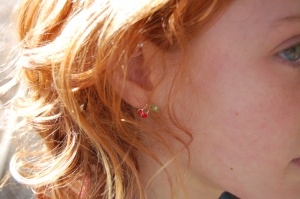 ok, here I'm just playing with the camera and the light.  But I love the sun on her hair and her cute new earrings.
