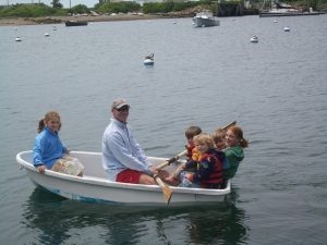 Uncle Rob rows all the kids out to the boat in the dinghy